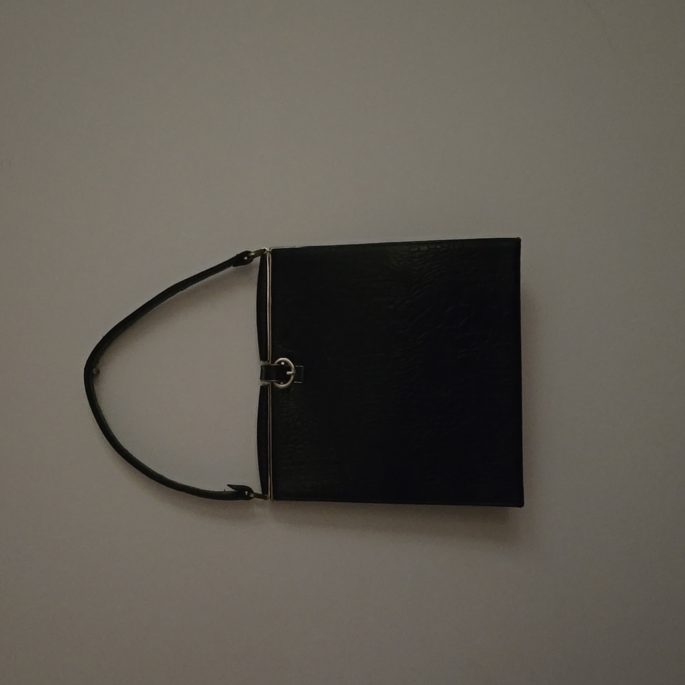 Chic Black Handbag with Gold Detail